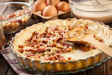 Making stuffing while preparing a traditional quiche