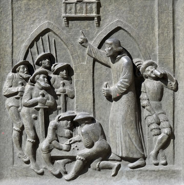 Zwingli preaches for the Swiss mercenaries at Monza before the battle of Maringnano, 1515., relief on the door of the Grossmunster ("great minster") church in Zurich, Switzerland