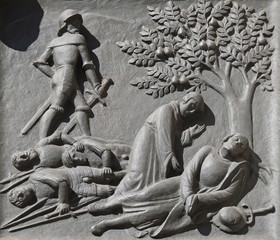 Zwingli's death on the battlefield at Kappel, 11 October 1531., relief on the door of the Grossmunster ("great minster") church in Zurich, Switzerland