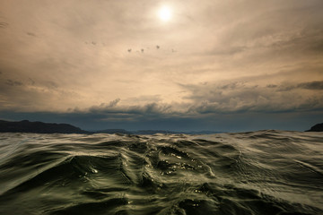 Fototapeta na wymiar Close up on wavy water surface. Norwegian fiord.