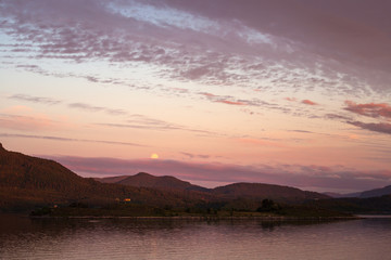 Moon rise and fantastic sunset time. Lesundøya island, Norway.