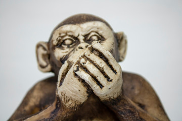 Speak no Evil Monkey Close up from the concept of see no evil, hear no evil and speak no evil.