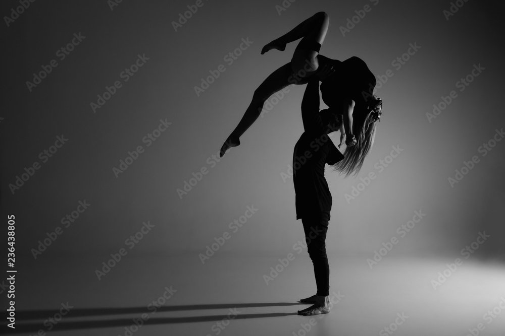 Wall mural two young modern ballet dancers in studio