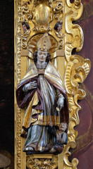 Fototapeta na wymiar Saint Martin statue on the altar of Saint Leodegar in the church of St. Leodegar in Lucerne, Switzerland