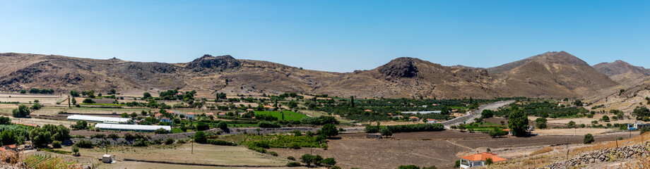 Panoramic view of moutain valley with farms