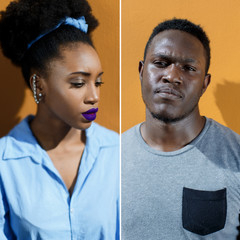African-American couple on the street on a yellow background