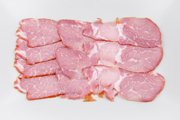 meat sliced in a rectangular shape on a light background