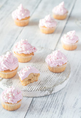 Many pink cream homemade cupcakes