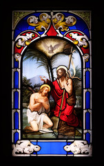 Obraz na płótnie Canvas Baptism of the Lord, stained glass window in the Church of St. Ambrose and Theodulus, Stresa, Lago Maggiore, Piedmont, Italy