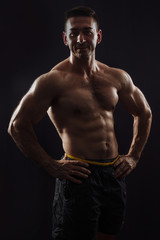 Obraz na płótnie Canvas bodybuilder on black background