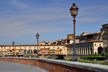 old street lamp in Florence with the famous old bridge (ponte vecchio) on background, Florence in Italy.