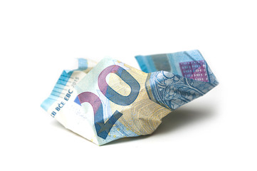 closeup of crumpled  twenty euros banknote on white background