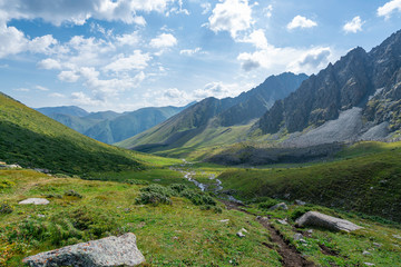 Fototapeta na wymiar Following the stream into the valley close to Karakol in Kyrgyzstan