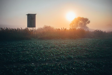 Hunting cabine and autumn sunrise