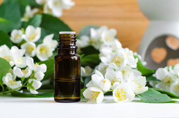 Small bottle of essential jasmine oil. Copy space.