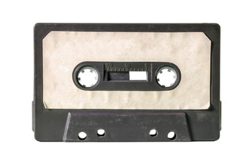 An old vintage cassette tape from the 1980s (obsolete music technology). Black plastic body, old...