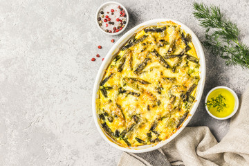 Creamy green bean casserole in a baking dish. Top view, space for text.