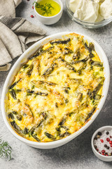 Creamy green bean casserole in a baking dish. Top view, space for text.