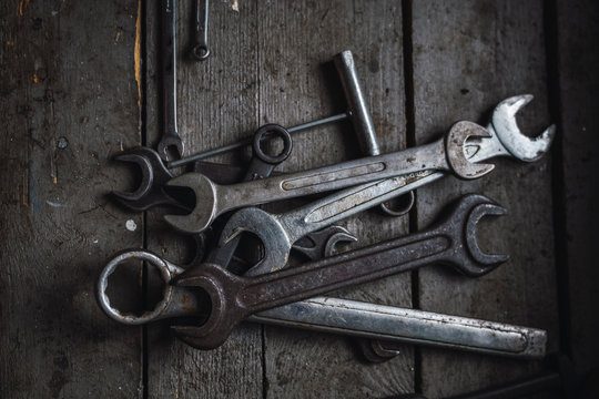 Group of wrenches on wood