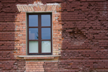 fragment of a brick wall with a window