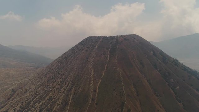 mountain landscape with volcano and mountains Tengger Semeru National park, Java, Indonesia. Aerial view volcano crater Aerial footage.