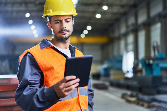 Man using tablet in factory