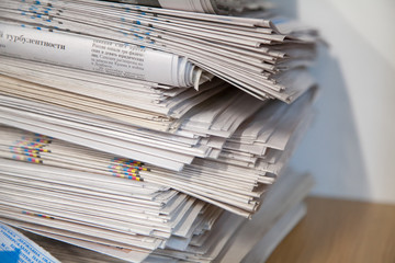  a stack of newspapers library
