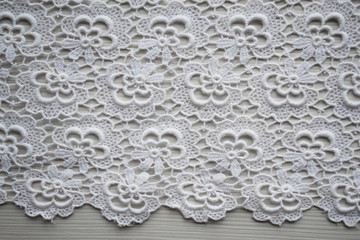Background. White knitted napkin, lace.
