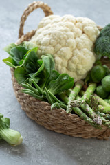 Cauliflower, green beans, bok choy, broccoli and brussel sprouts in a basket