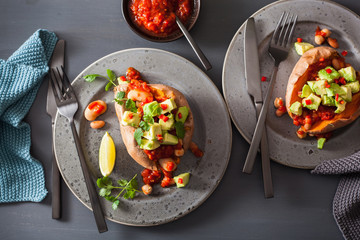 baked sweet potatoes with avocado chili salsa and beans