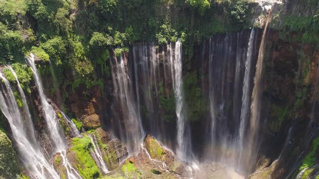 aerial view waterfall coban sewu in Java, indonesia. waterfall in tropical forest by drone Tumpak Sewu aerial footage