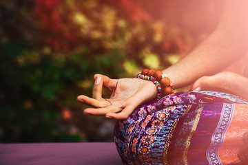 closeup of woman hand in mudra gesture practice yoga meditation outdoo
