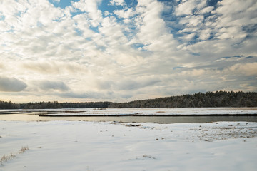 Winter landscape. River and forest in the background. USA. Maine. Portland.
