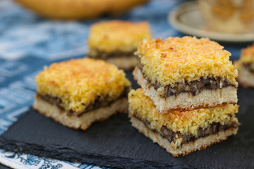 Banana cake with coconut flakes - festive dessert for Christmas, New Year, Close-up