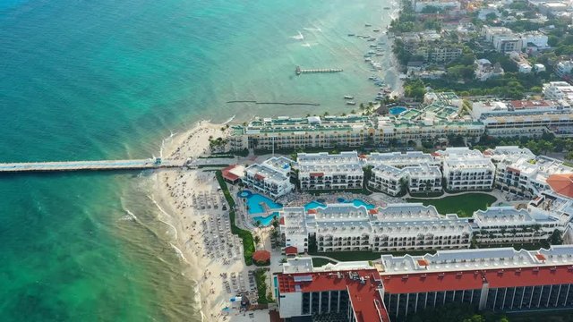 Aerial view of cityscape of Playa del Carmen, famous resort city by Caribbean Sea - landscape panorama of Yucatan Peninsula from above, Mexico, Central America, 4k UHD