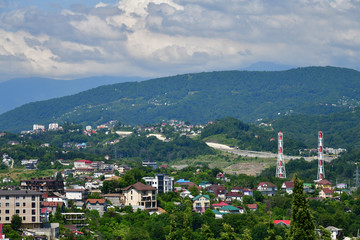 Fototapeta premium View of city of Sochi on the background of mountains, Russia