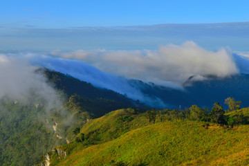 Natural landscape view with mists sea at sunrise. Mists in the cove. Mountain of fog, sun and win.