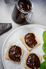 Vegan caviar made with chia seeds and nori. Appetizers on whole grain crispbreads