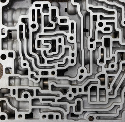 background. details of the automatic transmission, like a brain or a metal labyrinth.