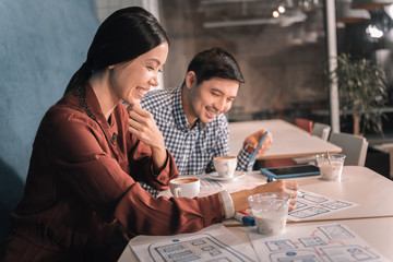 Managers meeting in cafeteria for discussing working moments