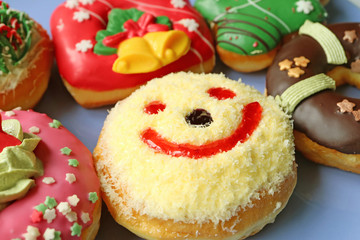 Close Up of Coconut Flakes Happy Face Sweets with Another Colorful Festive Decorated Doughnuts 