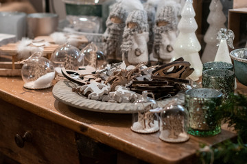 Christmas decoration on a desk at a christmas market. merry christmas, wooden decotration;