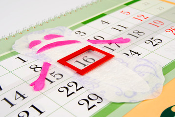 Women's sanitary napkin enjoys the beginning of the menstrual period. Menstrual calendar.