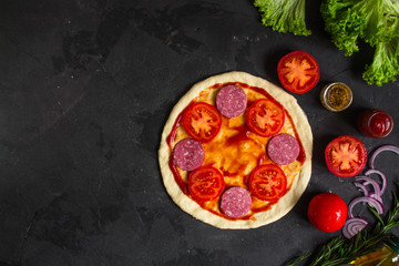 pizza, dough, ingredients, pepperoni, cheese, toatny sauce (cooking process). Top view with copy space