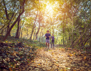 Obraz premium People running - athlete runners training jogging. Exercising runner couple working out living healthy lifestyle training.