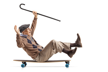 Cheerful senior with a cane sitting on a longboard and riding