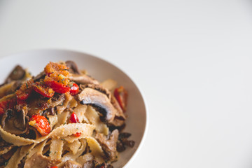Italian lunch with pasta, tomatoes and mushrooms