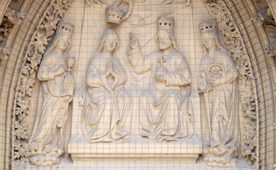 Fototapeta na wymiar The tympanum shows the Coronation of the Virgin portal of the Marienkapelle in Wurzburg, Bavaria, Germany