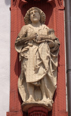 Fototapeta na wymiar Saint John the Baptist statue on the portal of the Marienkapelle in Wurzburg, Bavaria, Germany