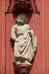 Fototapeta na wymiar Saint Bartholomew the Apostle statue on the portal of the Marienkapelle in Wurzburg, Bavaria, Germany